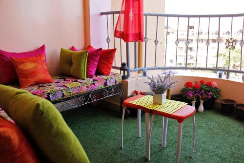 a living room with a couch and a table at Salmiya Place in Nairobi