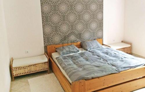 a bedroom with a wooden bed in a room at CUKROS Villa in Cserkeszőlő
