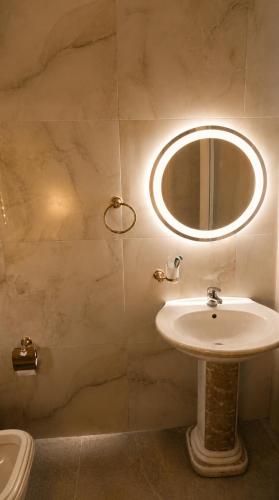 a bathroom with a sink and a mirror at Sunset Terrace in Durrës