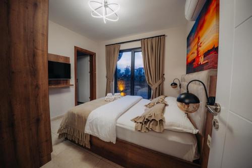 a bedroom with a bed and a large window at Monk By The Lake Sapanca in Sapanca