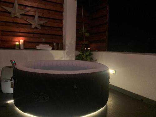 a bathtub in a room with two stars on the wall at Apartment Casa Sarajevo in Sarajevo