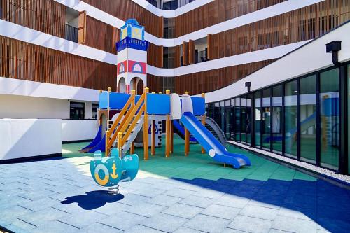 a playground in the middle of a building at Baltic Waves Resort by Baltic Home in Międzyzdroje