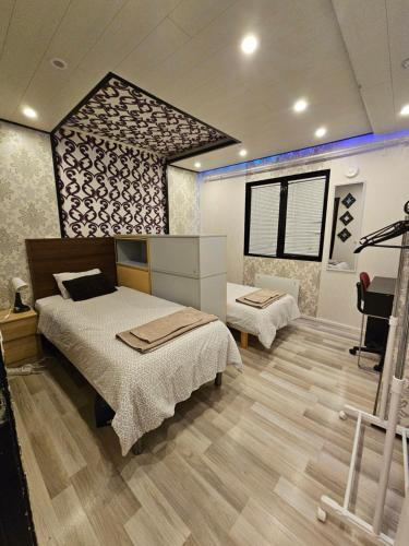 a bedroom with two beds in a room at House for 4 person near Meyer Turku in Turku