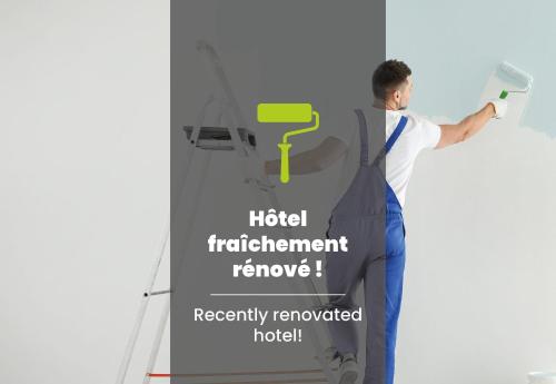 a man painting a wall with a brush at B&B HOTEL Le Havre Centre in Le Havre