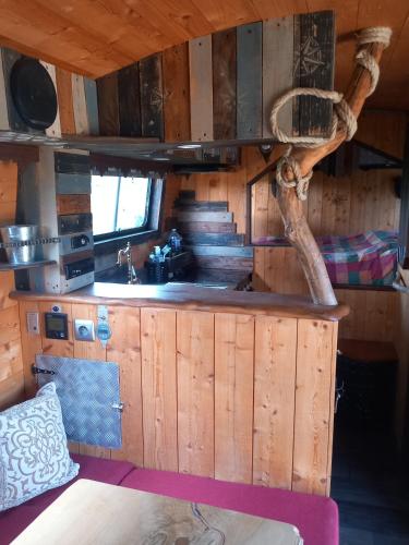 an interior view of a kitchen in an rv at Campertruck Off-Grid in Hénon