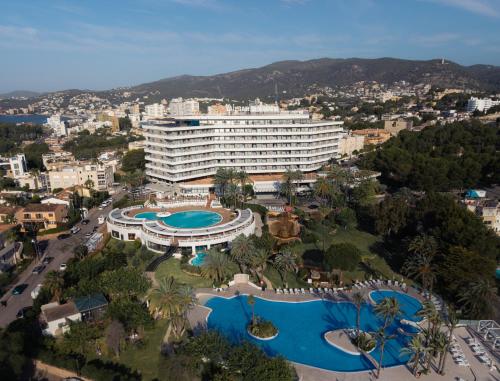 an aerial view of a large building with two swimming pools at GPRO Valparaiso Palace & Spa in Palma de Mallorca