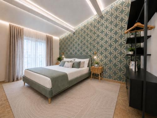 a bedroom with a large bed and a wall at Galeo Suites in Florence