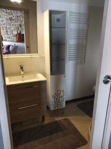 a bathroom with a sink and a mirror at Village house 8 beds in Joncels