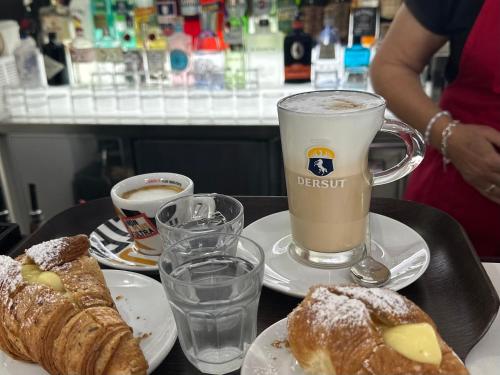 a table with two cups of coffee and pastries at Residenza Dottavio in Montenero di Bisaccia