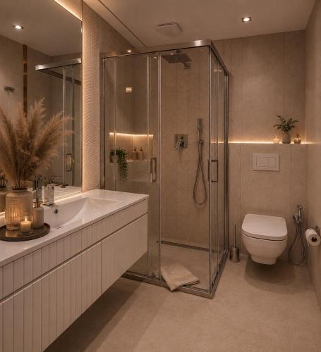 a bathroom with a shower and a toilet and a sink at Golden Trio Villas in Ząb