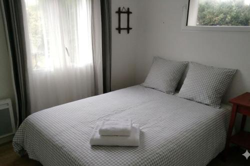 a bedroom with a bed with a tray on it at Seaside house with cliff views in Piriac-sur-Mer