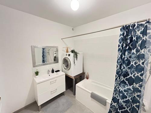 a bathroom with a sink and a tub and a shower at Cosy Magnolia Quartz - T3 - Hyper centre avec Parking in Pau