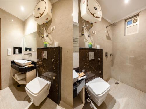 a bathroom with two toilets and a sink at Hotel Velocity Near Terminal 3 Delhi International Airport With- Free Pickup in New Delhi