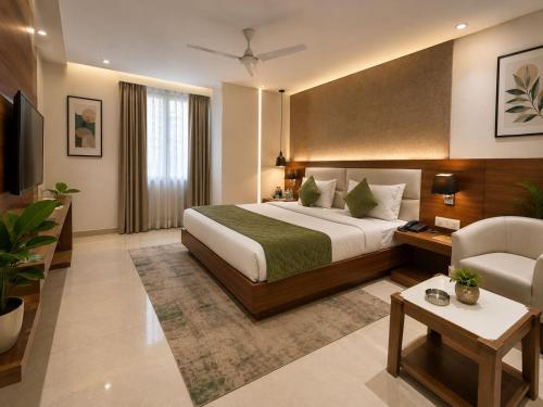 a hotel room with a bed and a chair at Airport Vistara Cove By Velocity Group Terminal 2,3 Delhi IGI Airport With free Airport Pickup in New Delhi