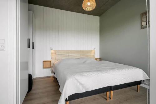 a bedroom with a large bed in a room at C11319-Tarm-Multebaervej-33 in Tarm