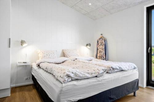 a white bedroom with a large bed in it at LF12002-Spottrup-Molleparken-17 in Spottrup
