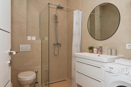 a bathroom with a shower and a toilet and a sink at Casa Dalmatia in Krvavica