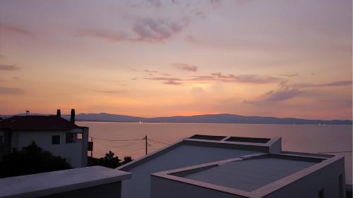 a view of a sunset from the roof of a house at NikolaosMare in Nea Potidaea