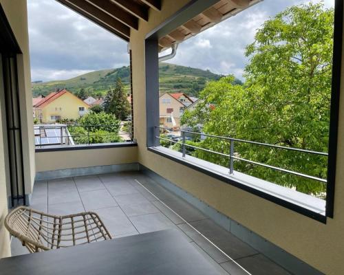 a balcony with a view of the mountains at Apartment Rotmilan in Vogtsburg