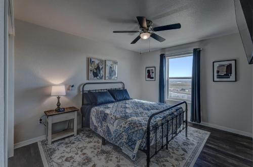 a bedroom with a bed and a ceiling fan at Executive Stay for Work & Family in Rapid City