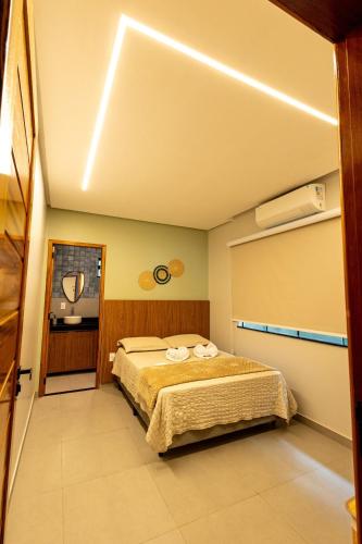 a bedroom with a bed in a room at Alter Casa Sawe, Alter do Chão, PA in Santarém