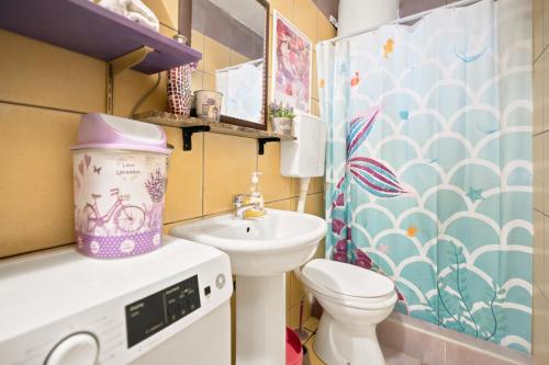 a small bathroom with a toilet and a sink at Apartman Mafini in Krašići
