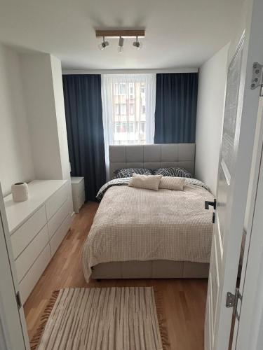 a bedroom with a bed and a window at Pavels Cozy Nook in Smolyan