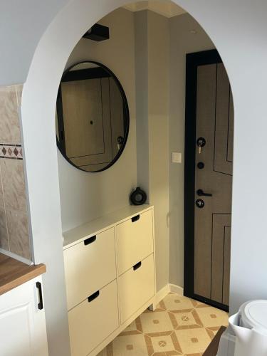 a bathroom with a mirror and a sink at Pavels Cozy Nook in Smolyan