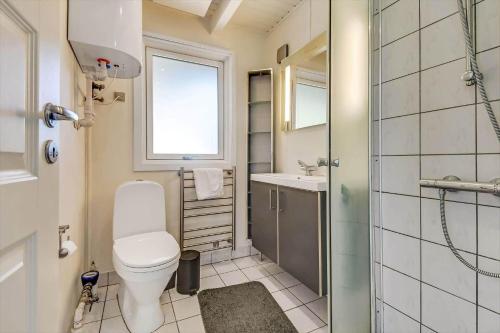 a bathroom with a toilet and a sink and a shower at C11596-Hemmet-Vester-Faelled-51 in Hemmet