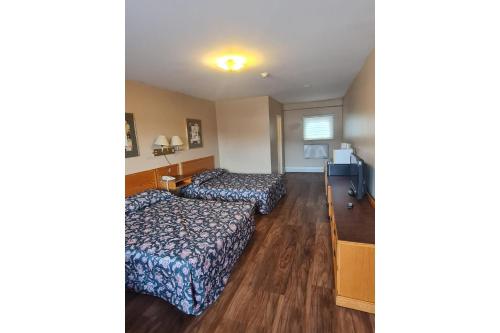 Voodi või voodid majutusasutuse Skyways Motel Muskoka Gravenhurst ON 11 toas