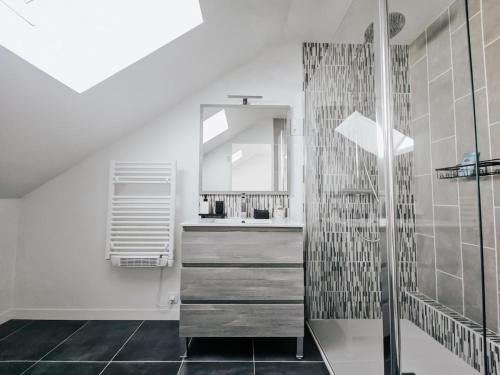 a bathroom with a shower and a sink at Champagne getaway, spacious house in Épernay