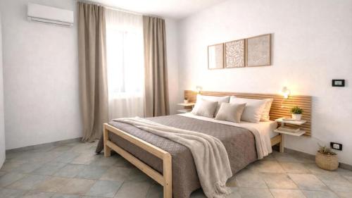 a bedroom with a large bed in a room at CASA NICOLAS 158 by SalentoAffitti in Neviano