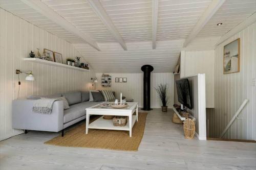 a living room with a couch and a table at C11638-Hemmet-Vester-Faelled-49 in Hemmet