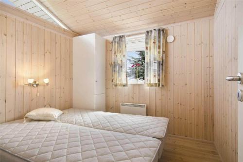 a bedroom with a bed in a room with a window at 30729-Odder-Alrovej-203-C in Odder