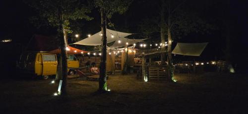 a tent with lights on it at night at van domloc in Carcassonne