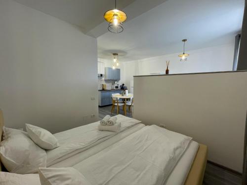 a bedroom with a bed with a towel on it at Casa Mihuț in Cordău