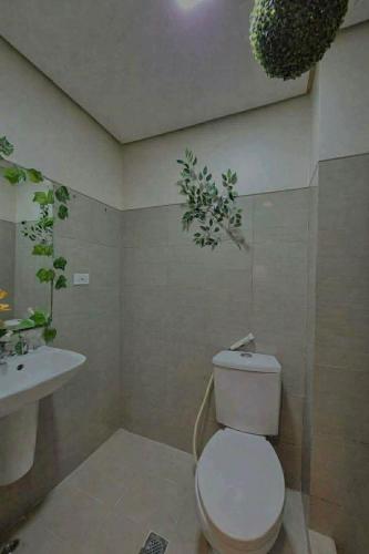 a bathroom with a toilet and a sink at Shore 1 tower D Pasay City in Manila