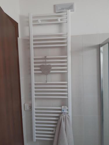 a towel rack with a heart on it in a bathroom at Tenuta Mazzotti in Lago