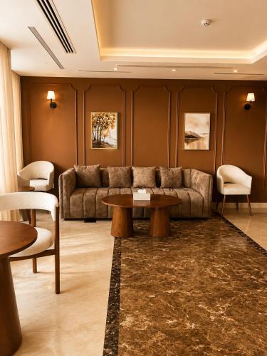 a living room with a couch and a table at Jwana in Riyadh