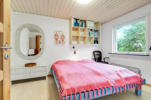 a bedroom with a bed and a mirror at C11253-Hemmet-Skuldbolvej-7-b in Hemmet