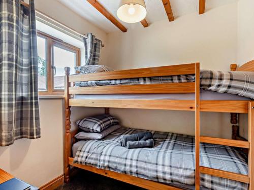 two bunk beds in a tiny house at 2 Bed in Dereham oc-92392 in Whissonsett