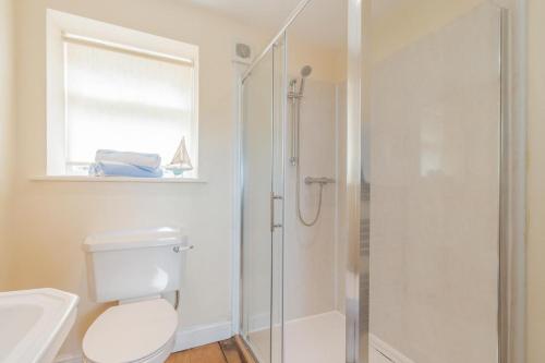 a bathroom with a shower and a toilet and a sink at 2 Bed in Newark oc-91051 in Caunton