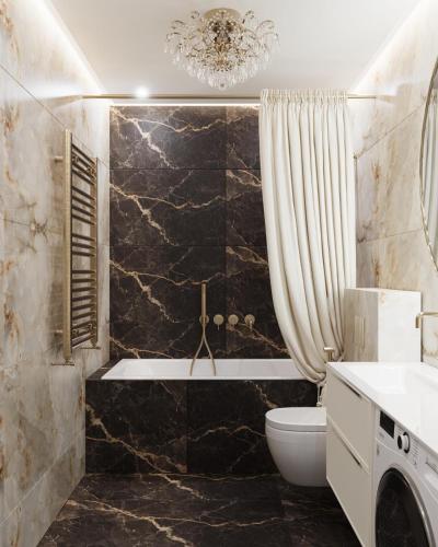 a bathroom with a tub and a toilet and a sink at Lutsk Elegance Apartment in Lutsk