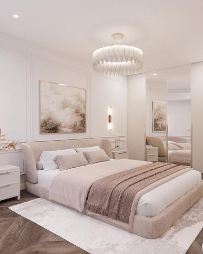 a white bedroom with a large bed and a chandelier at Lutsk Elegance Apartment in Lutsk