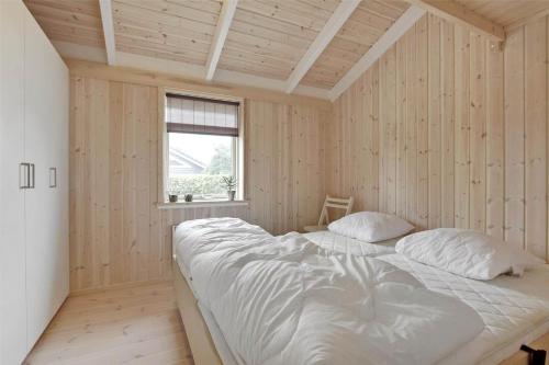 a bedroom with a large bed in a room with a window at 30078-Malling-Peter-Eriksensvej-21 in Malling