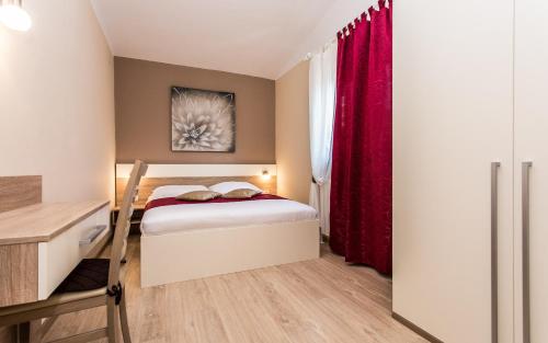 מיטה או מיטות בחדר ב-Apartments Polonijo