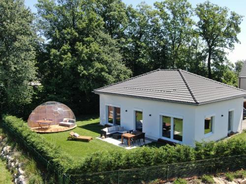 a small white house with a glass dome at Chasseral Sky Dome in Twann