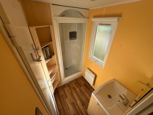 an overhead view of a bathroom with a sink and a mirror at l echo du canigou in Sahorre