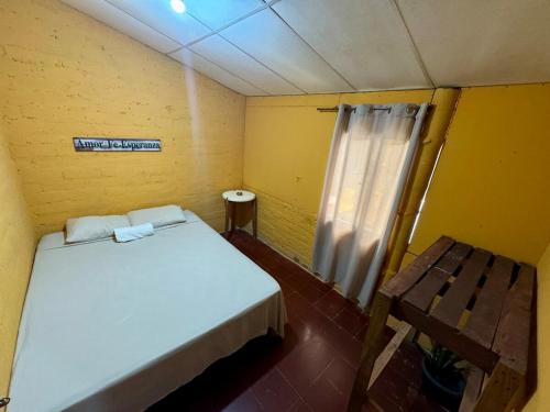 a small room with a bed and a window at Alojamiento Blankyta in Ahuachapán