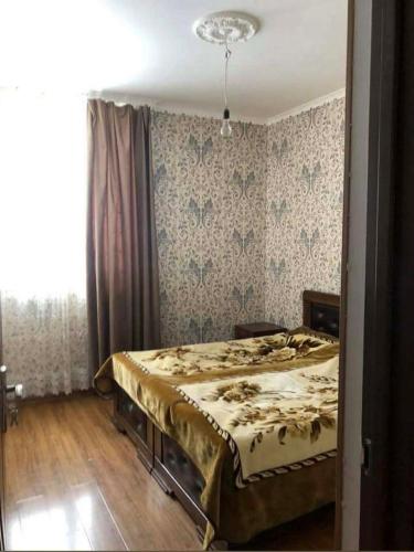 a bedroom with a bed in a room at Nakra Tower GuestHouse in Mestia
